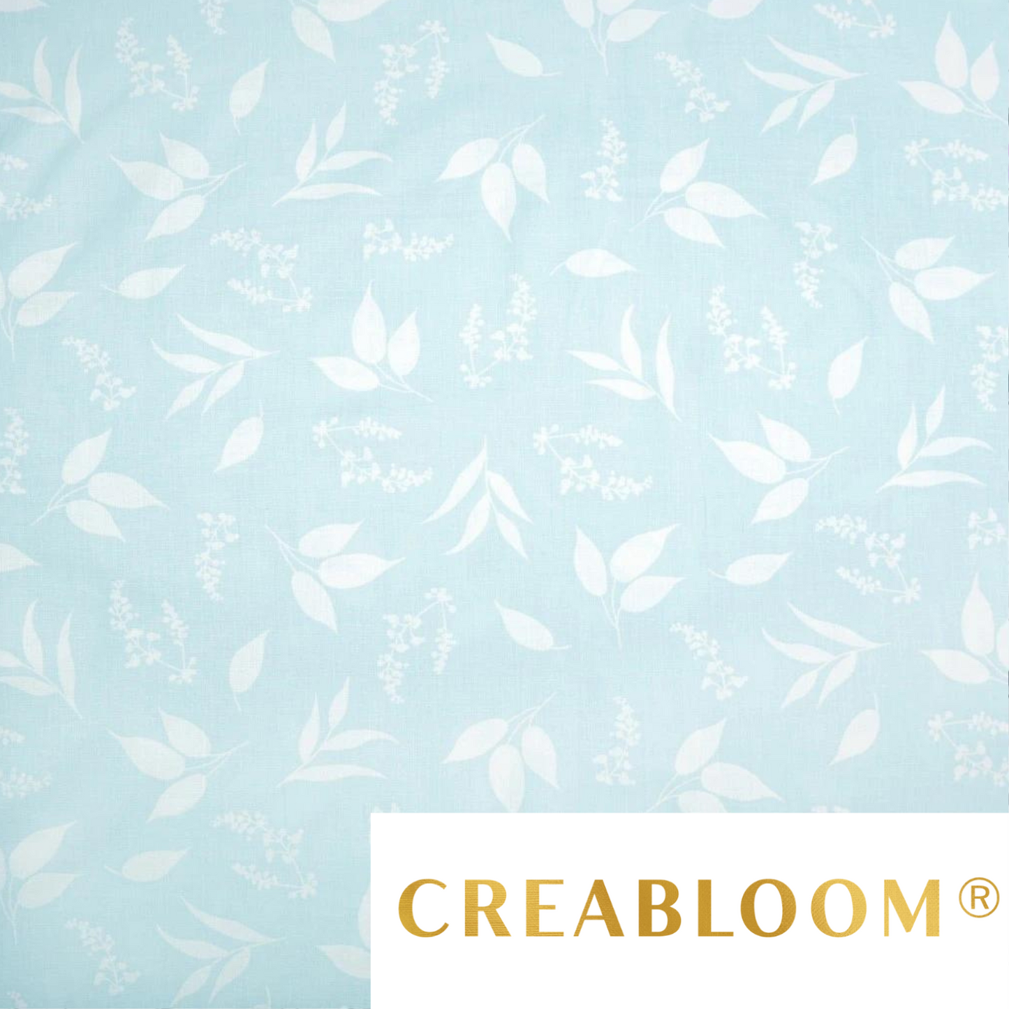 Tissu Coton Imprimé Feuilles Blanches Fond Bleu