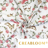 Tissu coton imprimé lapins, oiseaux et fleurs