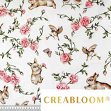 Tissu coton imprimé lapins, oiseaux et fleurs