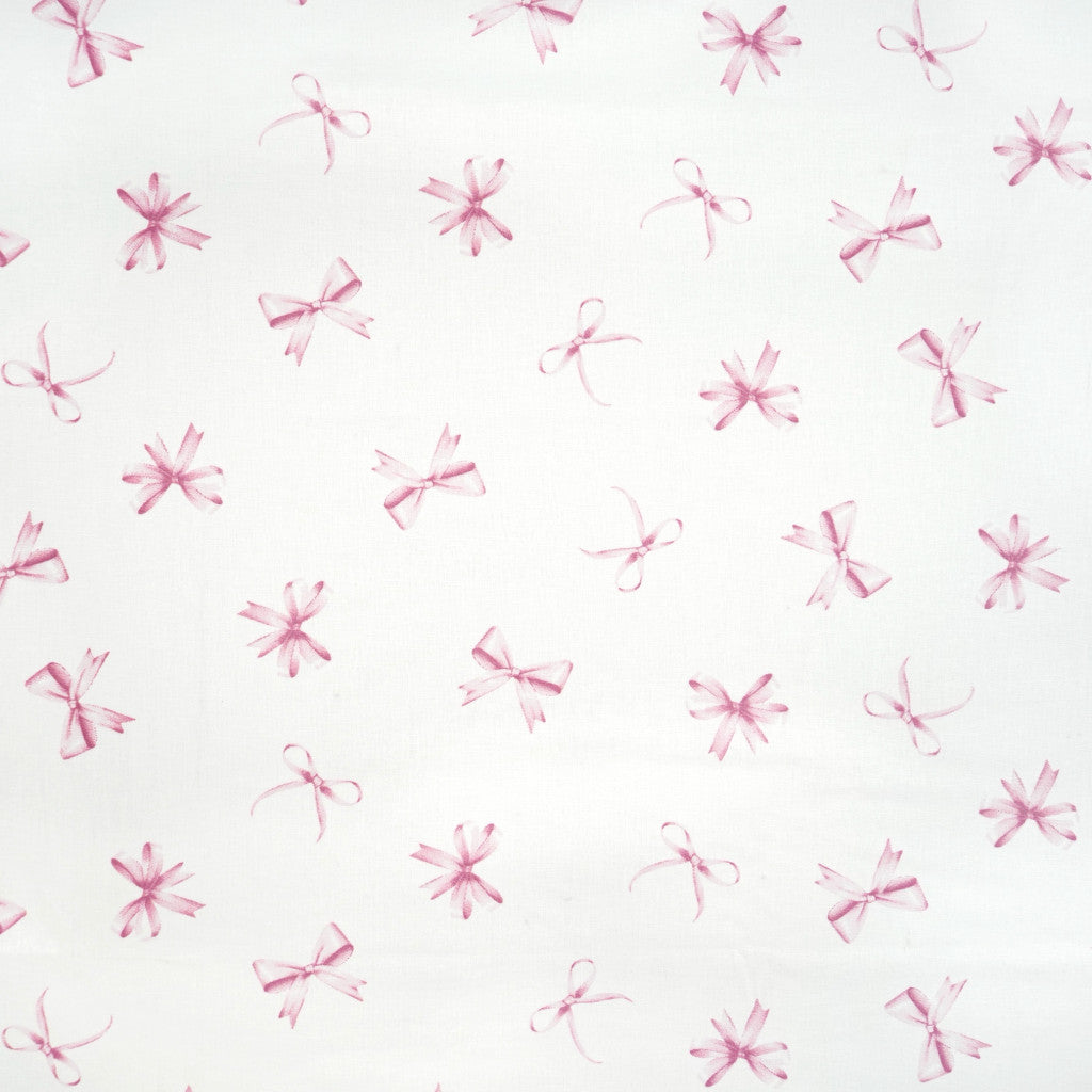 Tissu coton Motif nœuds rose