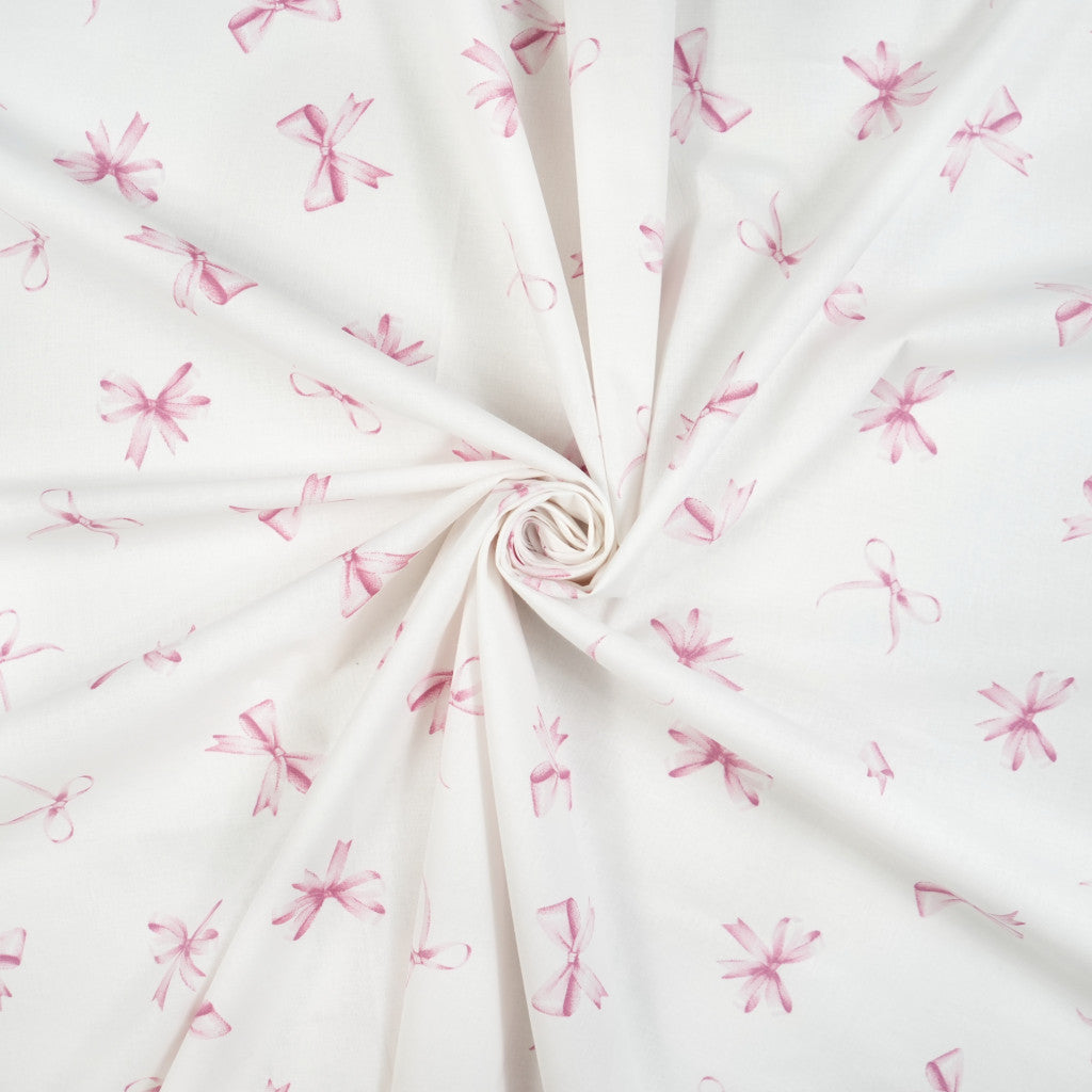 Tissu coton Motif nœuds rose