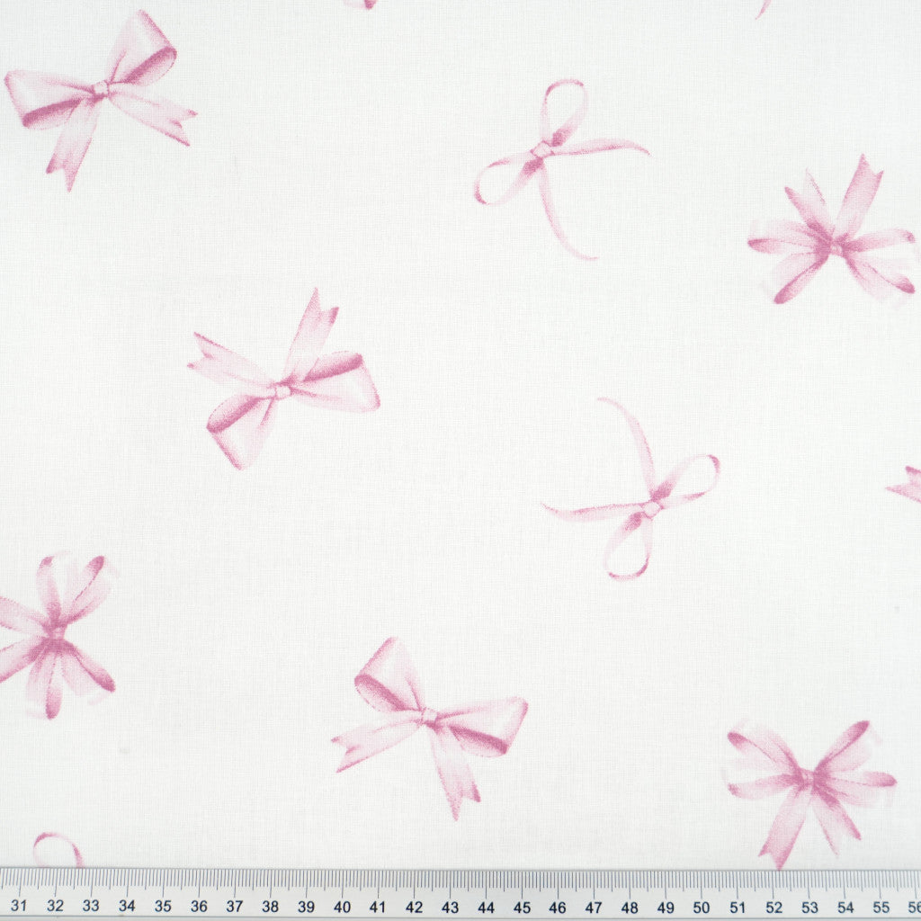 Tissu coton Motif nœuds rose